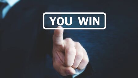 Man hand touching You Win text.の写真素材