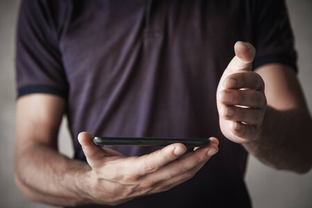 Man holding smartphone. Technology conceptの写真素材