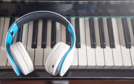 Headphones on the piano keyboard. Musicの写真素材