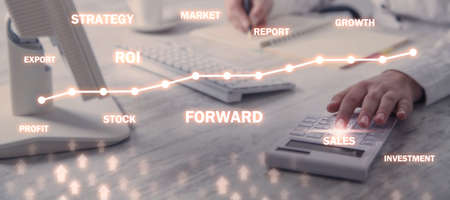 Business girl using calculator. Forward word with arrows and wordsの写真素材