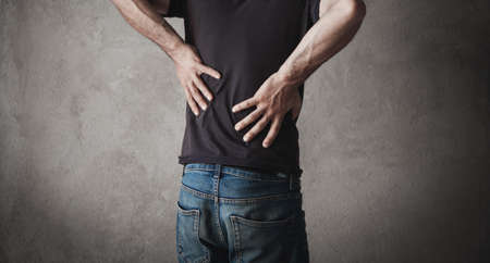 Caucasian man suffering from back pain.の写真素材