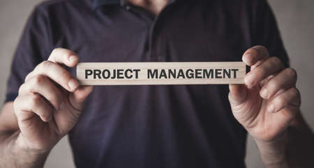 Man showing Project Management text on wooden block.の写真素材