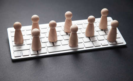 Computer keyboard, mouse and human figures. Social media, Network, Contact