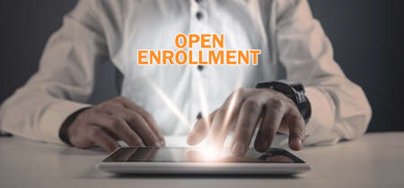 Man using tablet computer. Open enrollment