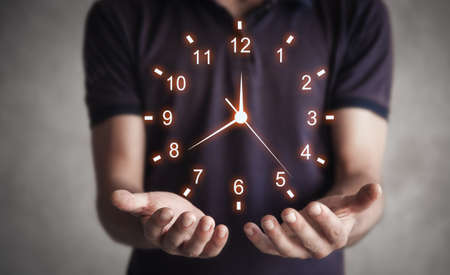 Man holding clock. Business time management