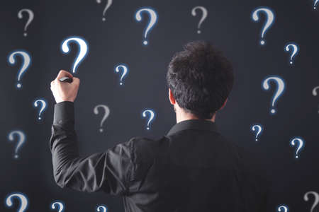 Businessman with question marks. Problem, Solutionの写真素材