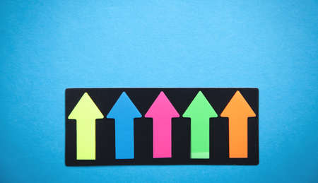 Colorful arrows on blue background.