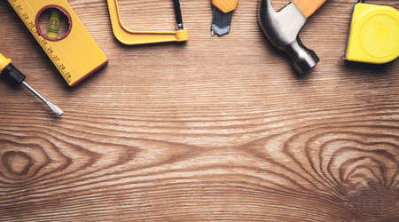 Work tools on wooden background.の写真素材