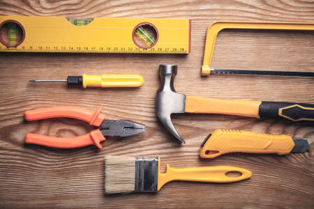 Work tools on wooden background.