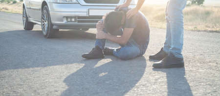 Car driver helping accident victim. People, Life, Car drivingの写真素材