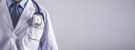 Doctor with money. Concept of corruptionの写真素材