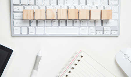 Wooden blank cubes on computer keyboard.の写真素材