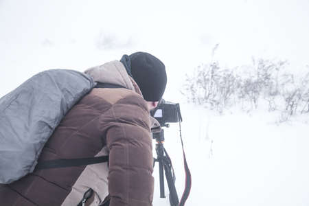 Photographer in winter. Winter. Snowy dayの写真素材