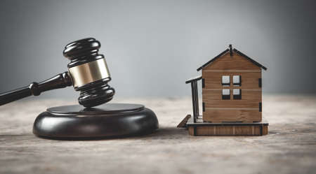 House model with a judge gavel.