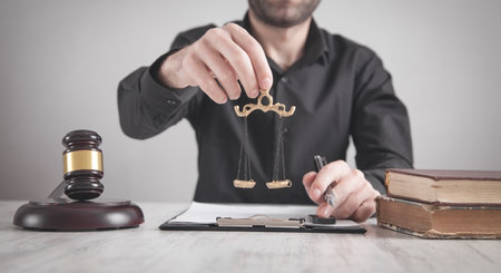 Judge holding scales in courtroom. law and justiceの写真素材