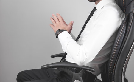 Caucasian businessman sitting in office chair.の写真素材