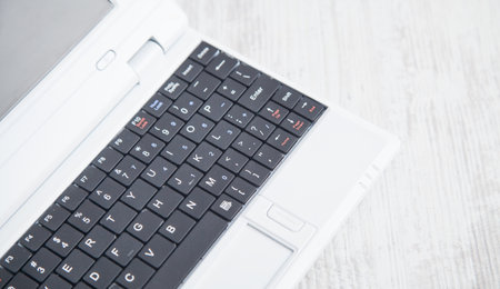 White laptop on the office desk. technology concept