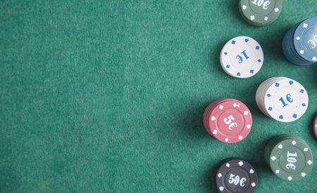 Casino chips on the green table.の写真素材