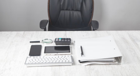 Computer keyboard, pen, calculator, document on the desk.の写真素材