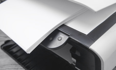 Xerox printer machine and papers on the desk.