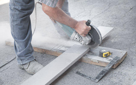 Worker cutting a tile with a grinder.の写真素材
