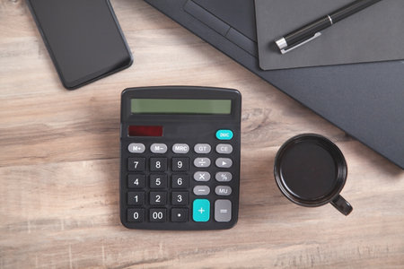office workplace. Coffee, calculator, pen, smartphoneの写真素材