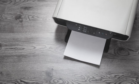 printer machine and papers on the desk.