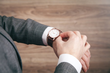 Businessman wearing luxury wrist watch. fashion, lifestyleの写真素材