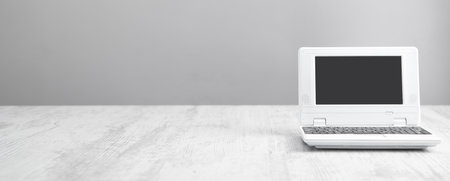 White laptop on the office desk. technology concept