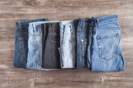 Jeans on the brown wooden background.の写真素材