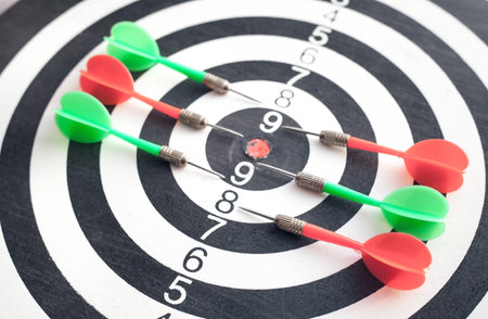 Dart arrows in the dartboard. success