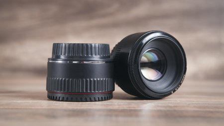 Camera lens on the wooden table.