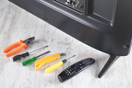 Tv and repairing tools on the table.
