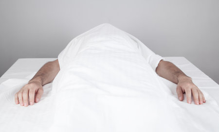 A dead man is lying in the morgue.