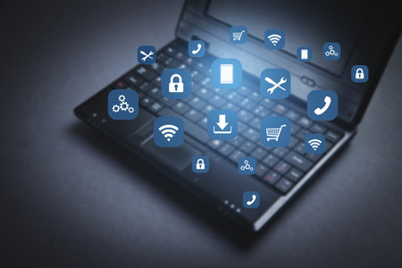 Black laptop computer and apps icons.