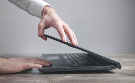 Caucasian businessman opening his laptop.の写真素材