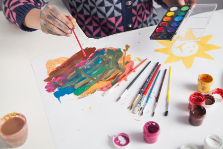 Painter holding brush and paint. hobbyの写真素材