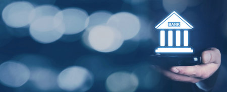Caucasian businessman holding bank icon. business. Financeの写真素材