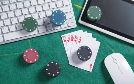 Computer keyboard, mouse, playing cards and chips. online casino