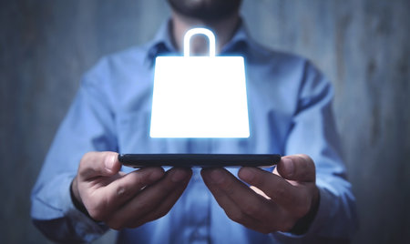 Man holding a smartphone with a shopping bag icon.