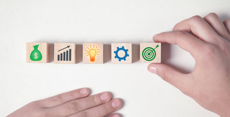 Business signs on wooden cubes. business process. Goal. Achievementの写真素材