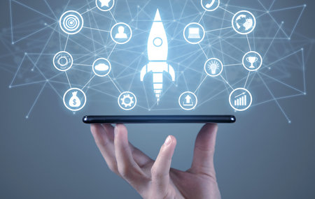 Male hand holding smartphone. Rocket symbol, business icons and network. business. startup