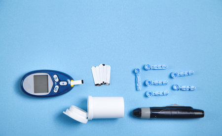 Glucometer with test strips and other objects. Devices for measuring glucose in the bloodの写真素材