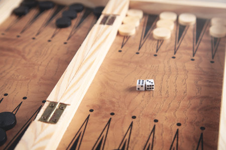 Figures with dice. wooden backgammon board gameの写真素材