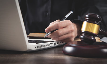 Male judge working in courtroom.