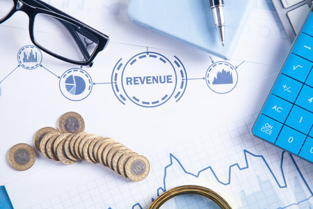 Calculator, eyeglasses, pen, coins. revenue. finance. Growthの写真素材