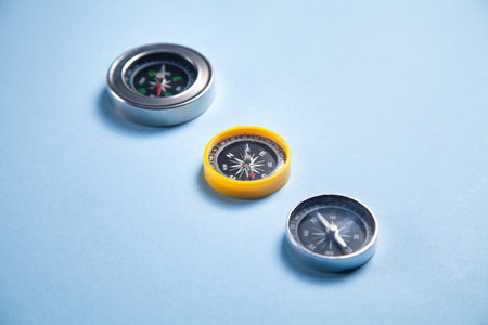Three compass on the blue background.