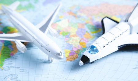 Two airplanes on world map. Travel