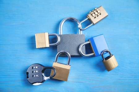 Different padlocks on the blue background.の写真素材