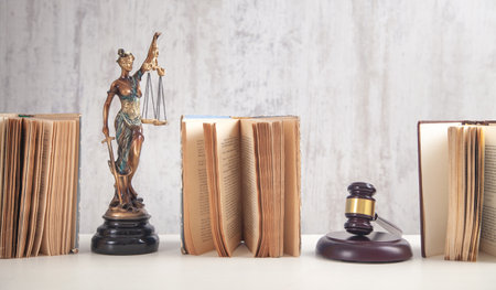 Statue of Lady Justice, book and gavel. Legal and Law